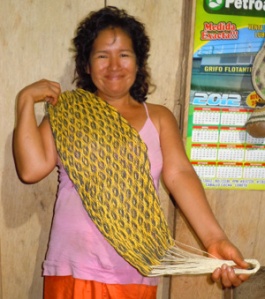  Yagua artisan Mariela from San José de Piri with woven doll hammock. Photo by Campbell Plowden/Center for Amazon Community Ecology