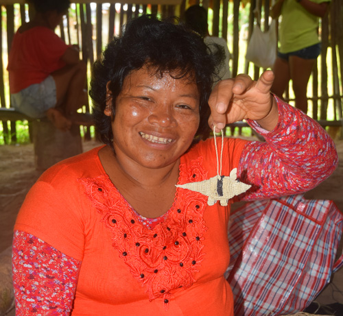 Bora artisan Ines C with her woven armadillo ornament.. Photo by Campbell Plowden / Center for Amazon Community Ecology